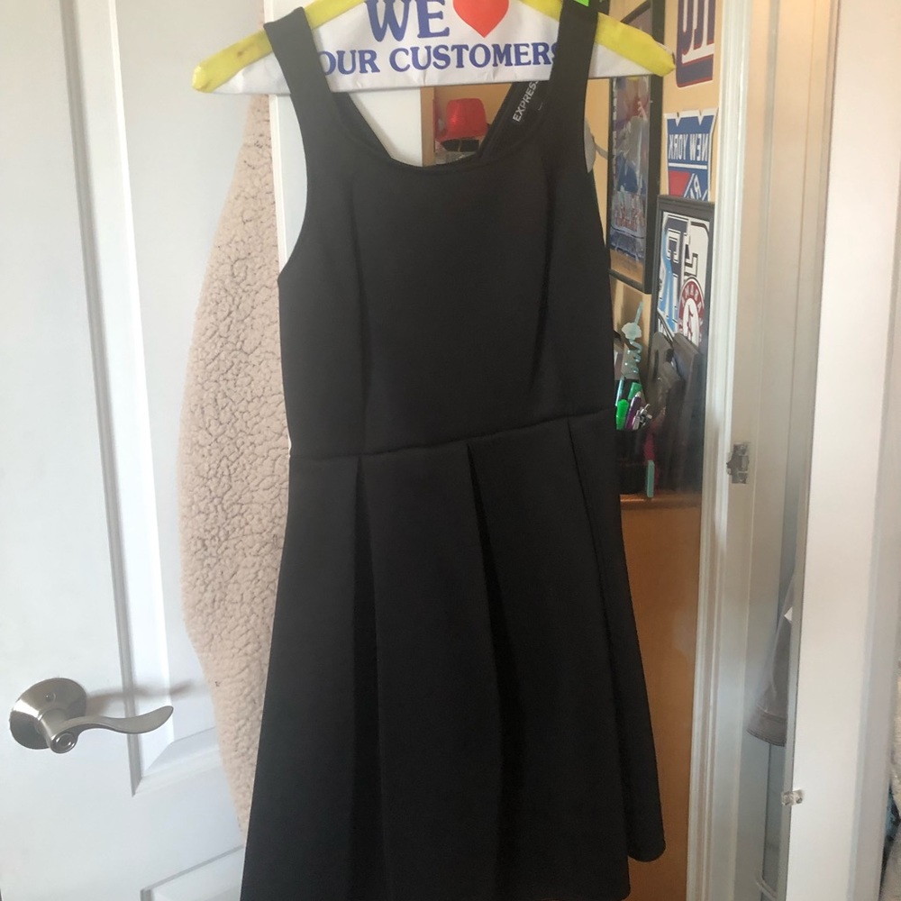 Black mini dress with open back. Express